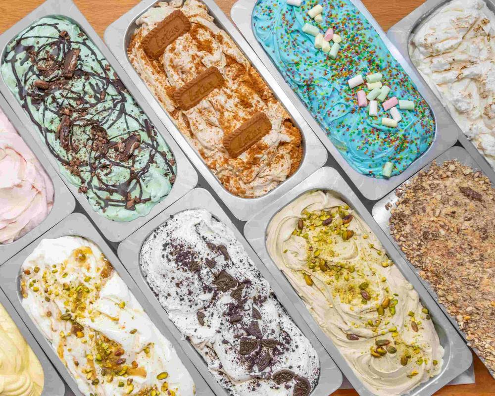 Trays of Yogelo gelato from above: mint choc chip, Biscoff, blue sprinkles with marshmallows, pistachio and cookies and cream